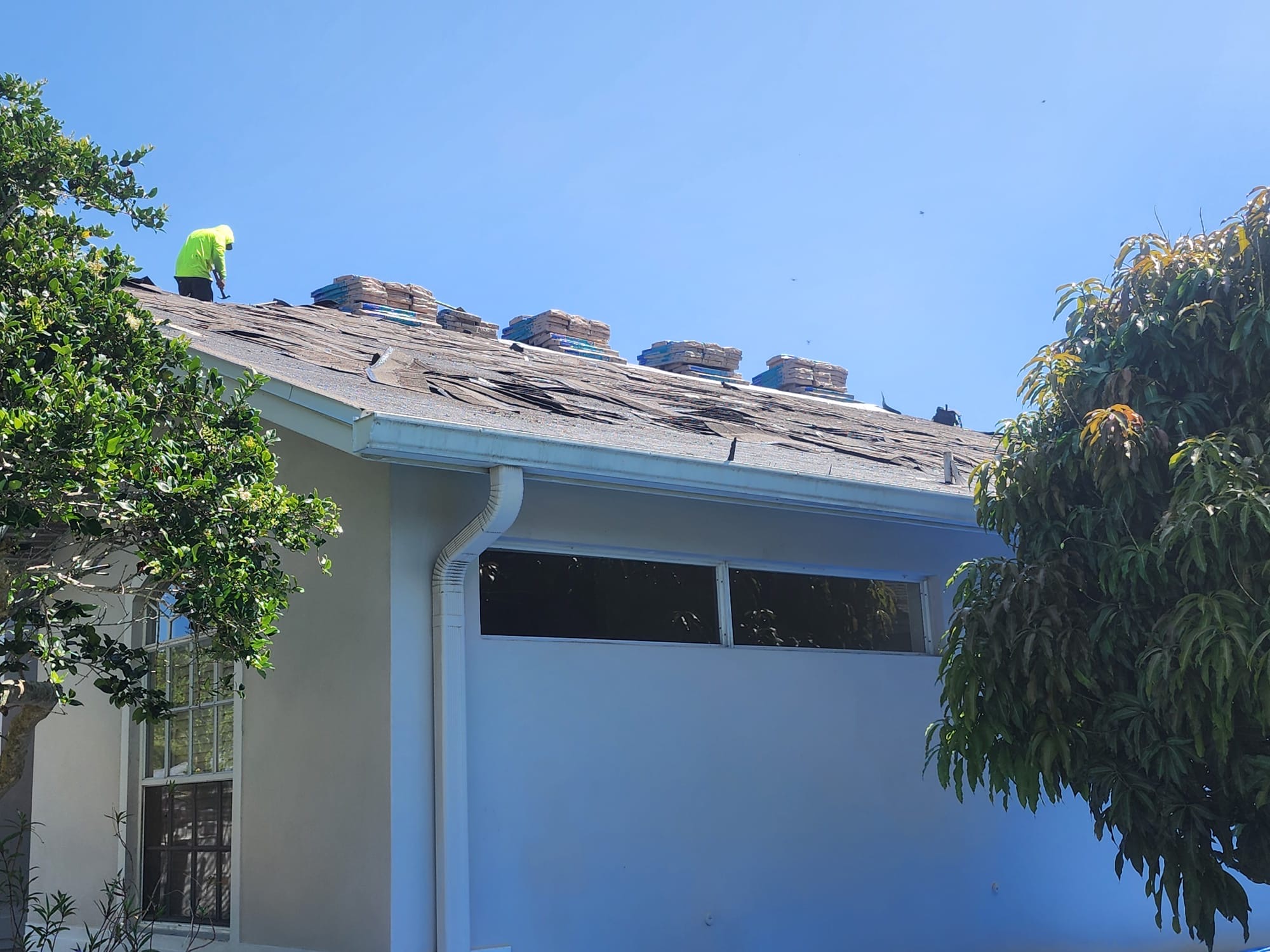 Storm-damaged shingles on a roof in the Florida Panhandle.