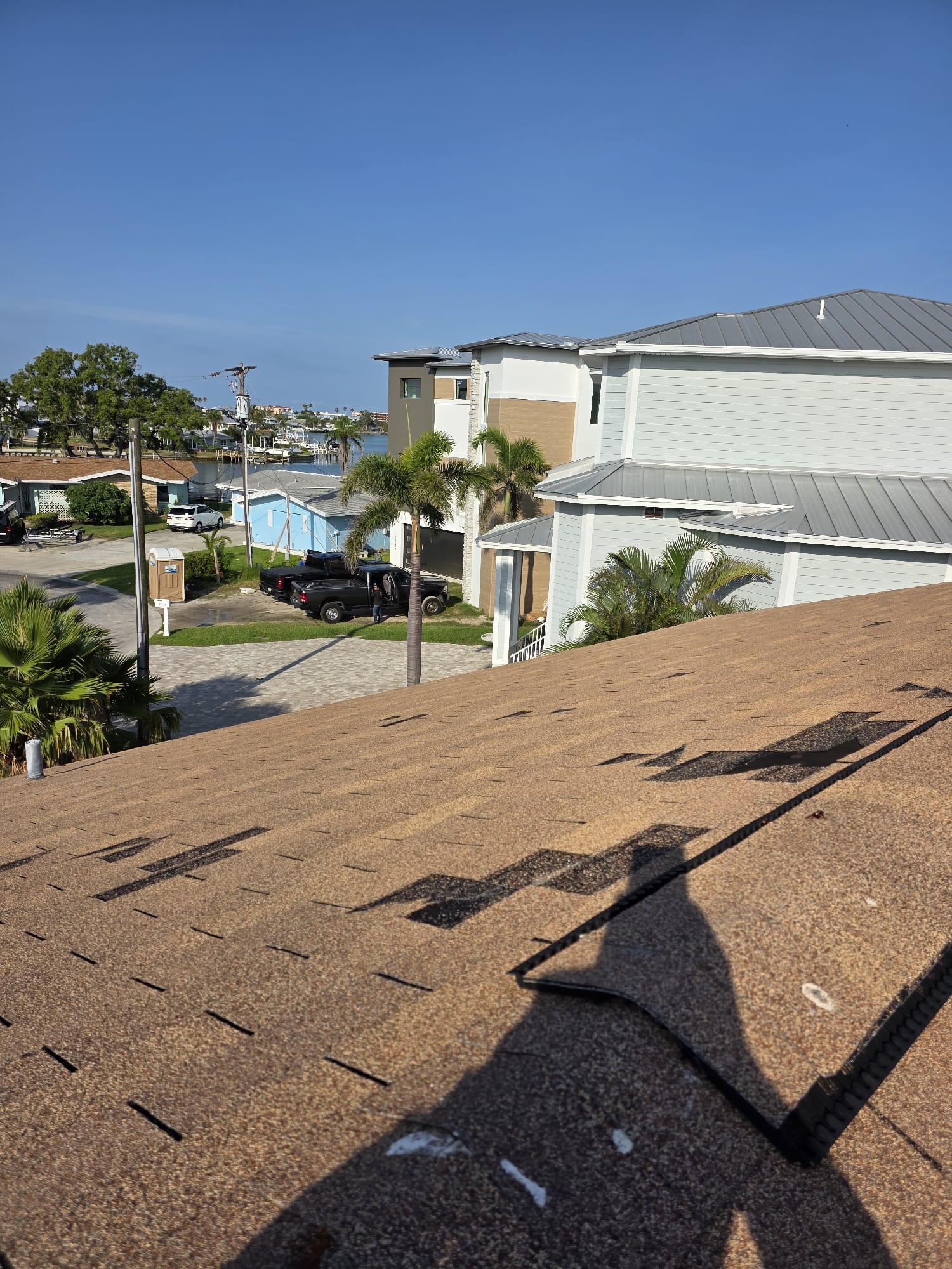 Gold Roofs crew installing a new roof on a home in Pasco County, FL.