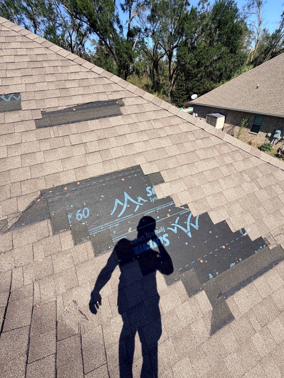 Gold Roofs inspector checking a roof for damage in Pinellas County, FL.
